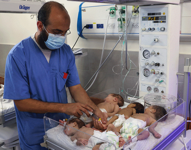 doctor with babies in neo natal unit