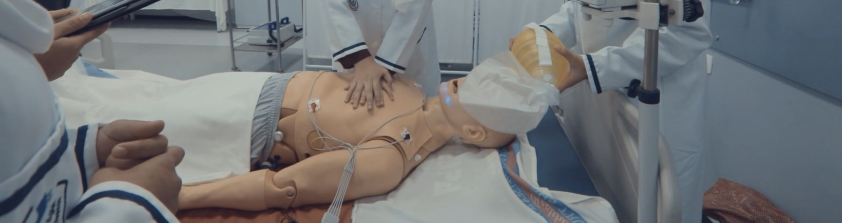 Medical trainees practising emergency care on a training mannequin