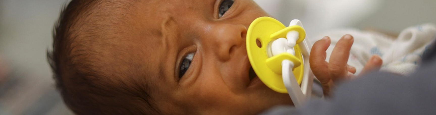 A newborn baby receiving hospital care